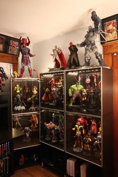 a bunch of action figures on display in a room