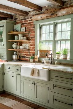 a kitchen with brick walls and green cabinets, an old fashioned sink is in front of the window