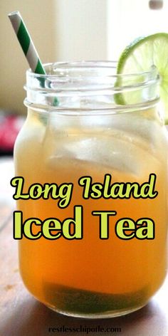 long island iced tea in a mason jar with limes and a straw sticking out