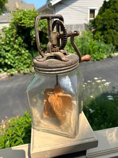 an old fashioned lantern sitting on top of a table