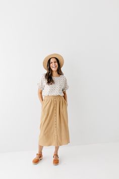 Start your day in style with the 'Greta' Skirt! This midi length, linen-blend skirt is light and airy for spring and summer and features button-down detailing for a fun touch. Pair the 'Greta' with all your favorite tops for Sunday morning or a day at the farmer's market! 30% Linen 70% Rayon Hand Wash Cold Hang to Dry Low Iron if Needed Do Not Dry Clean Fully Lined Model in Ochre Height 5'5" | Wearing Size Small Wearing 'Shalom' Geometric Print Top in Tan & 'Greta' Linen Blend Midi Skirt in Ochr Casual Linen Maxi Skirt For Beach, Linen Flowy Skirt For Vacation, Flowy Linen Skirt For Vacation, Summer Linen Skirt For Day Out, Relaxed Summer Maxi Skirt For Day Out, Buttoned Maxi Skirt For Spring, Summer Relaxed Maxi Skirt For Day Out, Summer Daywear Maxi Skirt With Lining, Beige Summer Maxi Skirt For Day Out