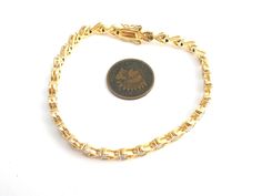 Vermeil Jewelry - This is a gold over sterling silver tennis style bracelet It has 4 tiny diamonds but gives the illusion that they are throughout the bracelet. Bracelet is 7.5" long, slightly under .25", weighs 13.1 grams and is hallmarked 925. Tennis Style, Diamond Tennis Bracelet, Tiny Diamond, Vermeil Jewelry, Tennis Bracelet Diamond, Tennis Bracelet, Silver Diamonds, Fashion Bracelets, Gold Bracelet