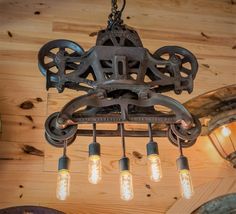 an old fashioned light fixture hanging from the ceiling