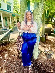 This is a 🛍️Shoppable🛍️ Pin!   Fall outfit, seasonal outfit, elevated casual outfit, midsize outfit, leopard print outfit Sweatshirt, blue satin pants, leopard sneakers, leopard purse, head scarf, boho jewelry midsize, curvy, outfit, idea, inspo, inspiration, outfit of the day, ootd, midsize ootd, curvy ootd, midsize outfit, curvy outfit, size 12, size 14, size 16, size18  #fall #outfits #ootd #outfitoftheday #womenswear #pumpkinseason Blue Satin Pants, Leopard Print Outfit