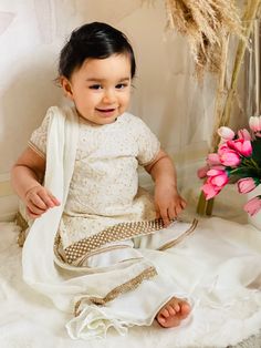 "✨ Let your little one steal the show in this adorable ivory garara set, featuring intricate embroidery and high-quality fabric that will make her look and feel like a princess.\" ✨ This Adorable Ivory Garara Set is the perfect choice for any little girl who wants to look cute and stylish. The set features a beautiful ivory color that adds an element of elegance and charm. The garara is made of high-quality fabric, ensuring that it feels soft and comfortable against your baby's delicate skin. The matching kurta top features intricate embroidery work that adds a touch of sophistication and beauty to the overall look.  ✨The Baby White Dress is designed to fit perfectly and move with your baby, allowing her to play and explore in comfort. This baby ivory garara set is a perfect choice for any Baby White Dress, Indian Dresses For Girls, White Salwar Suit, White Baby Dress, Traditional Indian Dress, Indian Dress, Gift For Daughter, Indian Outfit, Girls Clothing Sets