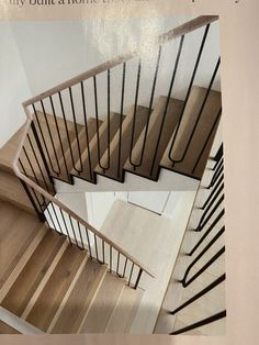 the stairs are made of wood and have handrails with black bars on them