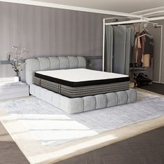 a bed sitting on top of a white rug next to a walk in closet