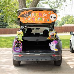 the trunk of a car decorated with halloween decorations