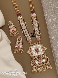 Description :- Antique Gold-Plated Indian Jewelry Set with Long Necklace and Earrings | South Indian Temple Jewelry Set | Gift For Her Gift yourself a royal look with this perfectly crafted kundan necklace set from Manalisstudio. Crafted with high quality kundan stones and pearls, it is impressive in design. The green enamel artwork adds perfect texture to the design. Perfect for weddings and festivities, this antique necklace set should be put on with your favorite sari or lehenga. 100% Satisfa Luxury Festive Temple Necklace With Stone Work, Luxury Temple Necklace With Zari Work For Gift, Indian Long Necklace, Kundan Long Necklace, South Indian Temple, Indian Jewelry Set, Jewelry Kundan, Temple Jewelry, Polki Necklace