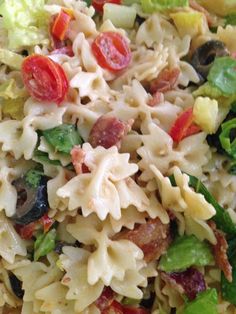 pasta salad with tomatoes, lettuce and olives