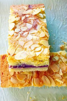 two slices of cake with almonds on top