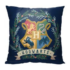 the hogwarts crest on a blue pillow