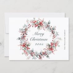 a christmas card with holly and berries on it