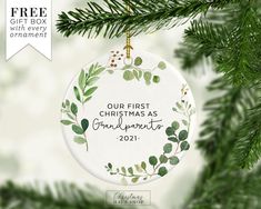 a personalized ornament hanging from a christmas tree with greenery on it