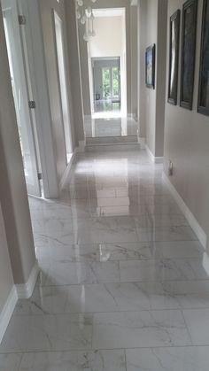 the hallway is clean and ready to be used as an entrance way for someone's home