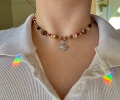 ✿ Citrine and Unakite Heart Trendy Necklace- unakite, moss agate, citrine crystal and clay beads within a variation of colorful glass beads.  The heart pendant is sterling silver plated and is tarnish resistant! ✿ 𝐀𝐛𝐨𝐮𝐭 𝐭𝐡𝐞 𝐏𝐫𝐨𝐜𝐞𝐬𝐬 I buy beads and wire from locally sources bead shops (including handmade glass beads) and then design and string all the necklaces. 𝐒𝐢𝐳𝐢𝐧𝐠 This necklace comes in the sizes 16, 18 and 20 inches. 𝐂𝐨𝐥𝐨𝐫𝐬 The colors in the photo indicate the typ Amber Beaded Crystal Necklace For Gift, Heart-shaped Beaded Necklaces With Natural Stones, Heart-shaped Beaded Necklaces With Natural Stones For Gift, Heart-shaped Natural Stone Beaded Necklace For Gift, Heart-shaped Beaded Necklace With Natural Stones For Gift, Bohemian Heart Jewelry For Everyday, Multicolor Heart Beads Sterling Silver Jewelry, Multicolor Sterling Silver Heart Beads Jewelry, Heart Shaped Agate Jewelry With Natural Stones