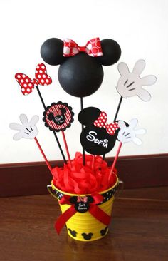 mickey and minnie mouse cupcake toppers in a bucket