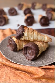 some chocolate covered pastries on a plate