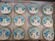 frosted cupcakes with snowmen on them