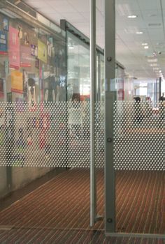 an office building with lots of glass doors