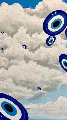 an abstract painting with blue and white circles floating in the air on a cloudy day