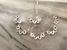 wine glass charms with letters and numbers on them