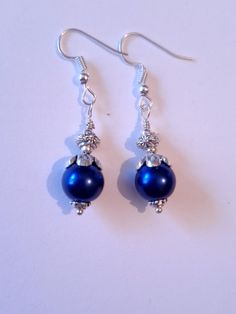 Cobalt blue pearl silver earrings Royal blue pearl silver tone earrings bohemian earrings wedding jewelry Victorian jewelry set Boho set Bohemian Cobalt blue glass pearl and silver-tone Victorian filigree jewelry set earrings and necklace . Silver-tone beautiful Boho jewelry set earrings and necklace . Bohemian jewelry set . Victorian style silver tone and fine Royal blue glass pearl dangle earrings and necklace . Chic silver toned pearls jewelry set . Romantic blue pearls jewelry set . Brides or bridesmaids jewelry set . Absolutely beautiful jewelry set ! YOU MAY CHOOSE FROM THE OPTIONS MENU FROM THE FOLLOWING OPTIONS: EARRINGS,  JEWELRY SET NECKLACE AND EARRINGS,  OR JEWELRY SET +BRACELET FREE SHIPPING  Material : blue glass pearls, silver tone metal ornaments beads, steel , silver-tone Blue Pearl Jewelry For Jewelry Making, Elegant Royal Blue Beaded Jewelry, Blue Pearl Jewelry For Party, Party Pearl Jewelry In Blue, Sapphire Nickel-free Jewelry For Party, Nickel-free Sapphire Jewelry For Party, Adjustable Blue Pearl Drop Jewelry, Blue Pearl Drop Jewelry, Elegant Blue Round Bead Jewelry