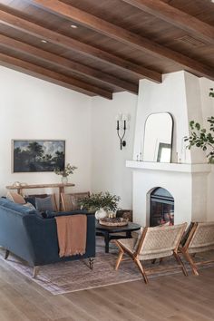 a living room filled with furniture and a fire place