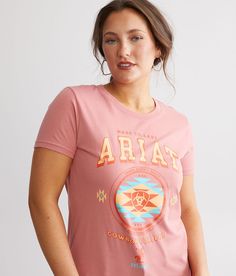 Ariat Cowboy College T-Shirt - Pink X-Large, Women's Dustyrose Graphic t-shirt Bust measures 33 on size small Body length 26 1/2 on size small. 100% Cotton. Machine wash cold. Do not bleach. Tumble dry low. Do not iron. Do not dry clean.. Measurements: Bust -Fullest part of bust with arms at sides. Waist -Circumference of natural waist: above belly button below rib cage. Hips -Standing with feet together fullest part of hips. WOMEN'S TOP SIZE CONVERSION CHART Size US/CAN BUST WAIST XXS 00 29-30 Basic Pink Top With Screen Print, Basic Pink Tops With Screen Print, Pink Fitted Graphic Tee, Basic Pink Screen Print Top, Basic Pink Tops With Graphic Print, Pink Cotton Top With Front Print, Pink Cotton Tops With Front Print, Pink Short Sleeve Shirt With Front Print, Pink Short Sleeve Tops With Front Print