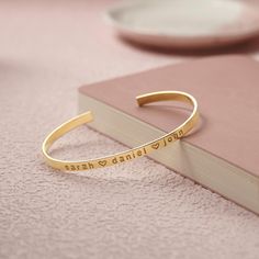 Enjoy the elegance of our Personalized Gold and Silver Name Bangle, exquisitely crafted from durable, hypoallergenic stainless steel that guarantees it will never tarnish or fade. Featuring adjustable chain lengths and the option for front and back engraving, this piece is not only a stylish accessory but a meaningful gesture, perfect for any occasion. Whether celebrating a birthday, anniversary, or Mother's Day, this bracelet serves as a heartfelt reminder of your affection, beautifully packaged in a gift box for a memorable unboxing experience. PRODUCT ∙ INFORMATION: 🌟 Personalization: Front and back engraving to capture special names or dates. ✨ Material: High-quality stainless steel with anti-tarnish coating for lasting wear. 💖 Adjustable Fit: Easily adjustable chain for a comfortabl Customised Bracelets, Womens Cuff Bracelets, Gold Engraving, Engraved Bracelet, Name Bracelet, Personalized Bracelets, Beautiful Gift Boxes, Stylish Accessories, Gifts For Wife