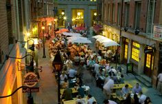 an overhead view of people sitting at tables outside