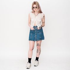 "Vintage Y2K button denim mini skirt in blue  Size on tag : EUR 34, Approx. size : S/M, Length : 40 cm / 16\", Waist : 33 cm / 13\". Material : Denim, Lining : -.  Model Height : 165 cm / 5'4\"." 90s Style Mini Denim Skirt For Summer, 90s Style Denim Mini Skirt For Summer, 90s Denim Mini Skirt For Summer, 90s Denim Mini Skirt, 90s Style Denim Mini Skirt, 90s Style Summer Denim Mini Skirt, 90s Style Medium Wash Denim Skirt, 90s Style Denim Blue Skirt For Summer, 90s Medium Wash Denim Skirt For Summer