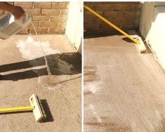 a person using a squirt to clean the cement on top of a sidewalk