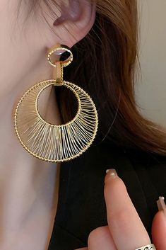 Elevate your style with our Metal Hollow Large Circle Earrings. These striking earrings feature intricate metalwork in a bold circular design, adding a touch of elegance to your look. Crafted with high-quality materials, they not only enhance your allure but also exude sophistication. Perfect for formal occasions, cocktail parties, or when you want to make a statement with your outfit, these earrings are the ideal choice to complement your ensemble with a touch of contemporary charm. Evening Gowns Elegant, Circular Design, Cocktail Parties, Elegant Accessories, Circle Earrings, Elegant Earrings, Metallic Accents, Showcase Design, Formal Event