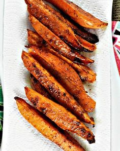 cooked sweet potato wedges on a white plate