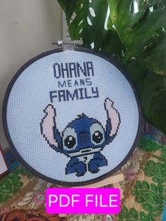 a cross stitch pattern with the words ohana means family on it and an image of lilpui