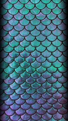 the scales of a fish's tail are blue and green, as well as purple