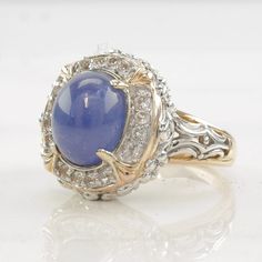 This ring is a size 7 (USA); It may not be resized Markings: 925, China, Indiscernible signature (Tested & guaranteed to be Sterling Silver) This ring weighs 7.7 Grams The Stone/Design is  Tanzanite, White Topaz -Natural tanzanite  The Ring face measures 11.1 x 8.9 mm (center stone) The condition of this ring is Estate, Great, some color variation on band, very light patina This vintage item is circa Pre 2004  For more vintage sterling silver rings please visit:  https://www.etsy.com/shop/Silver Tanzanite Round Stone Jewelry For Anniversary, Tanzanite Center Stone Jewelry For Anniversary, Anniversary Jewelry With Round Tanzanite Stone, Heirloom Tanzanite Jewelry For Anniversary, Round Tanzanite Jewelry With Diamond Accents, Tanzanite Jewelry With Accent Stones For Anniversary, Fine Jewelry Birthstone Ring With Stone Setting For Anniversary, Fine Jewelry Birthstone Ring For Anniversary, Classic Gemstones With Stone Setting For Anniversary