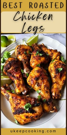 the best roasted chicken legs on a white plate with limes and cilantro