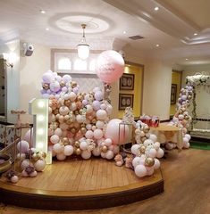 a room with balloons and decorations on the floor