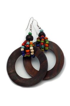 two wooden hoop earrings with beads on them