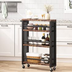 a kitchen cart with bottles and glasses on it