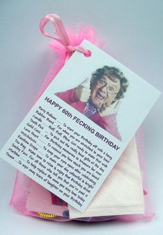 an old woman's birthday card is wrapped in pink