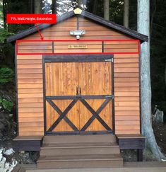 a small wooden building in the woods