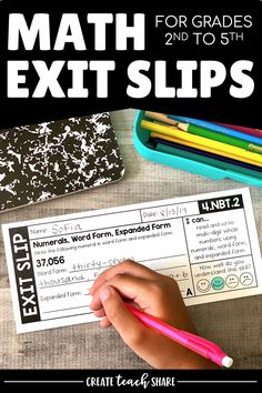 a close up of a person holding a pencil near a paper with the words math exit slips on it