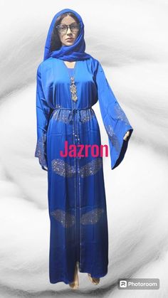 Step out in style with our stunning Blue Chiffon Abaya Dress designed with Rhinestone embellishments for women. This elegant dress is perfect for any special occasion, featuring a flattering silhouette and a touch of sparkle that will make you stand out from the crowd. The matching scarf adds an extra touch of sophistication, completing your look effortlessly. Made from high-quality chiffon fabric, this dress is not only beautiful but also comfortable to wear. Whether you're attending a wedding, a party, or simply want to elevate your everyday style, this dress is sure to turn heads wherever you go. Elevate your wardrobe with our Blue Chiffon Abaya Dress today! Elegant Blue Party Thobe, Blue Embellished Thobe For Eid, Embellished Blue Thobe For Eid, Bohemian Blue Festive Abaya, Festive Blue Embellished Abaya, Traditional Blue Embellished Abaya, Blue Floor-length Eid Kaftan, Embellished Long Blue Abaya, Blue Embellished Long Abaya