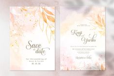 two wedding cards with watercolor flowers and leaves on them, one in gold and the other in pink