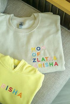 Celebrate motherhood with our cozy embroidered Mama Sweatshirt, personalized with your kids' names. Perfect for twin moms, boy moms, girl moms and every loving momma, this sweatshirt makes a thoughtful gift for any occasion. Whether you're a proud twin mom or simply want to cherish your little ones, this sweatshirt is the perfect way to keep them close to your heart. To receive your Sweatshirt in Gift Packaging: 1. Add the Sweatshirt you want to your cart 2. Add the Gift box in the appropriate s Cotton Tops With Embroidered Logo, Cotton Tops With Embroidered Logo As Gift, Personalized Cotton Crew Neck Sweatshirt, Cotton Sweatshirt With Multicolor Embroidered Text, Cotton Tops With Embroidered Logo For Gift, Multicolor Embroidered Cotton Sweatshirt, Personalized Cotton T-shirt, Embroidered White Tops For Mother's Day, Custom Embroidered White Tops For Mother's Day