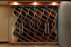 a wine rack with many bottles in it