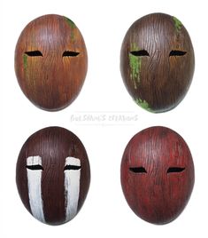 four different types of painted wooden faces